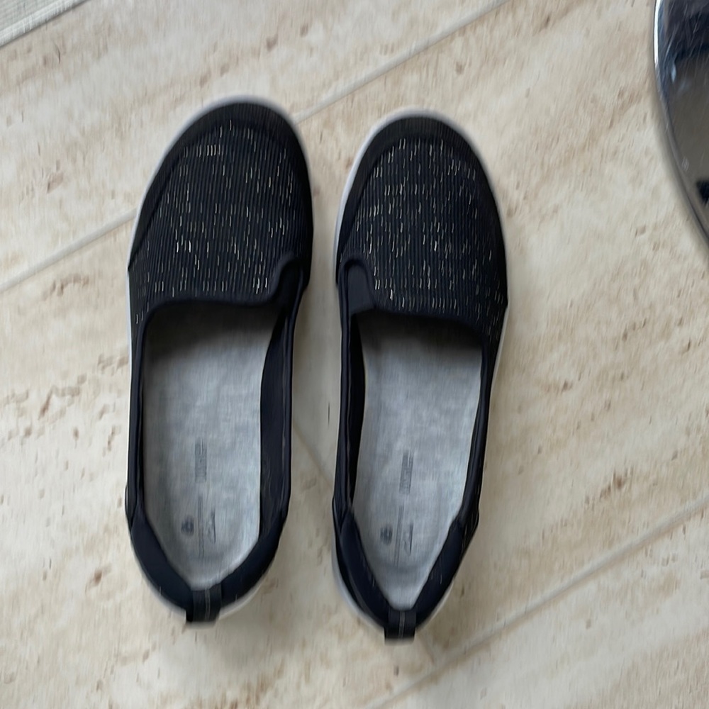 Clarks shoe that are black with sparkles.